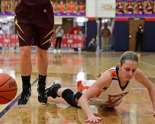AUSTINTOWN, OHIO - FEBRUARY 27, 2017: Gabby Hartnell #10 of Howland falls to the floor after losing control of the ball while being pressured by Riley Norquest #15 of Southeast during the second half of their game Monday night at Austintown Fitch High School. DAVID DERMER | THE VINDICATOR