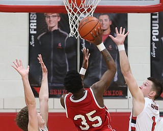 Niles senior guard Ty'rese Williams(35) goes up for two goes up for two during the 2nd quarter as Niles McKinley takes on Canfield, Tuesday, Feb. 28, 2017 at Canfield High School. Canfield won 70-42...(Nikos Frazier | The Vindicator)..