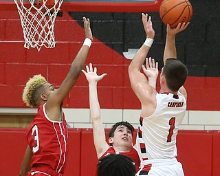 Canfield senior guard Jake Cummings(1) goes up for two during the 2nd quarter as Niles McKinley takes on Canfield, Tuesday, Feb. 28, 2017 at Canfield High School. Canfield won 70-42...(Nikos Frazier | The Vindicator)..