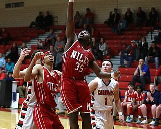 Niles senior guard Ty'rese Williams(35) goes up for two during the 3rd quarter as Niles McKinley takes on Canfield, Tuesday, Feb. 28, 2017 at Canfield High School. Canfield won 70-42...(Nikos Frazier | The Vindicator)..