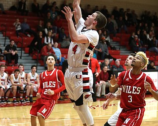 Canfield senior guard Brandon McFall(4) goes up for two during the 3rd quarter as Niles McKinley takes on Canfield, Tuesday, Feb. 28, 2017 at Canfield High School. Canfield won 70-42...(Nikos Frazier | The Vindicator)..