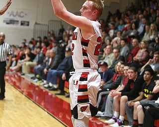 Canfield junior guard Ian McFraw(22) goes up for three during the 3rd quarter as Niles McKinley takes on Canfield, Tuesday, Feb. 28, 2017 at Canfield High School. Canfield won 70-42...(Nikos Frazier | The Vindicator)..