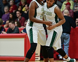 STRUTHERS, OHIO - MARCH 1, 2017: Anyah Curd #30 of Ursuline celebrates with teammate Dayshanette Harris #1 after the final buzzer of their tournament game Wednesday night at Struthers High School. DAVID DERMER | THE VINDICATOR