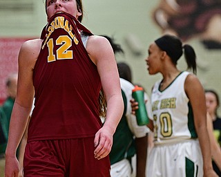 STRUTHERS, OHIO - MARCH 1, 2017: Taylor Martin #12 of Mooney walks of the court after being defeated by Ursuline in their tournament game Wednesday night at Struthers High School. DAVID DERMER | THE VINDICATOR