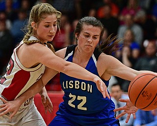 STRUTHERS, OHIO - MARCH 1, 2017: Alex Bell #22 of Lisbon knocks the ball away from the control of Brittany Mook #22 of Columbiana during the first half of their tournament game, Wednesday night at Struthers High School. DAVID DERMER | THE VINDICATOR