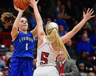 STRUTHERS, OHIO - MARCH 1, 2017: Izzy Perez #1 of Lisbon puts up a shot over Tessa Liggett #5 of Columbiana during the first half of their tournament game, Wednesday night at Struthers High School. DAVID DERMER | THE VINDICATOR