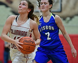 STRUTHERS, OHIO - MARCH 1, 2017: Mariah Rovnak #13 of Columbiana drives on Karlee Pezzano #2 of Lisbon during the second half of their tournament game, Wednesday night at Struthers High School. DAVID DERMER | THE VINDICATOR