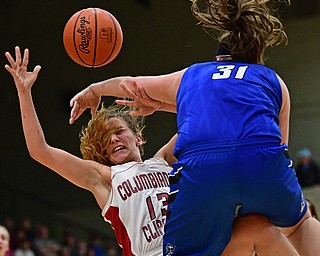 STRUTHERS, OHIO - MARCH 1, 2017: Mariah Rovnak #13 of Columbiana is fouled hard by MacKenzie Mason #31 of Lisbon during the second half of their tournament game, Wednesday night at Struthers High School. DAVID DERMER | THE VINDICATOR