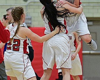 STRUTHERS, OHIO - MARCH 1, 2017: Kayla Muslovski #4 of Columbiana celebrates with teammates Taylor Logan #11 and Brittany Mook #22 after defeating Lisbon in their tournament game, Wednesday night at Struthers High School. DAVID DERMER | THE VINDICATOR