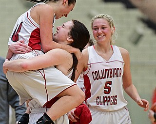 STRUTHERS, OHIO - MARCH 1, 2017: Kayla Muslovski #4 of Columbiana celebrates with teammate Kennedy Fullum #15 after defeating Lisbon in their tournament game, Wednesday night at Struthers High School. DAVID DERMER | THE VINDICATOR