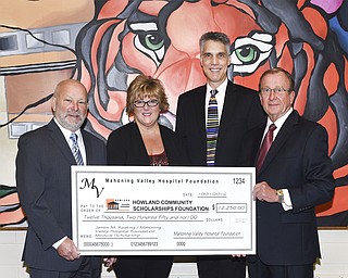 SPECIAL TO THE VINDICATOR
Mahoning Valley Hospital Foundation recently donated $12,250 to Howland Community Scholarships Foundation. MVHF has pledged four more donations to the scholarship foundation that will total $44,500 in five years. The James M. Keating/MVHF Medical Scholarship of $3,000 will be presented every year to a Howland High School senior who plans to study medicine at any accredited school in Ohio. Present for the donation, from left, were Michael Senchak, president and CEO of MVHF; Wendy Miller, scholarship foundation; Andy Bednar, president of scholarship foundation; and James M. Keating, chairman of MVHF.