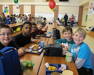 Neighbors | Alexis Bartolomucci.Fourth-grade students at Austintown Intermediate School sat with each other during the No One Eats Alone lunch day on Feb. 10.