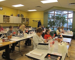 Neighbors | Alexis Bartolomucci.Guests at Fellows Riverside Gardens decorated mason jars to hold their decorated cookies in to make a cookie bouquet on Feb. 11.