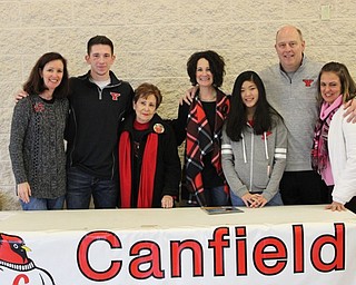 Neighbors | Abby Slanker.Canfield High School senior football player Jake Cummings’ family, from left, aunt Jennifer Taylor, Cummings, grandmother Grace Abernethy, mom Barb Cummings, sister Grace Cummings, dad Mike Cummings and aunt Chris Anania, were all on hand to witness the signing of Cummings’ letter-of-intent to continue his athletic career at Youngstown State University at a signing ceremony at the high school on Feb. 1
