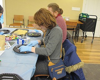 Neighbors | Alexis Bartolomucci.Scarlett made sushi out of different kinds of candy at the Poland library on Feb. 9.