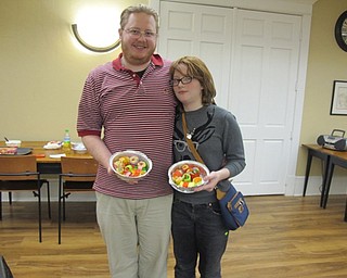 Neighbors | Alexis Bartolomucci.Scarlett and her dad, Matthew, showed off the sushi they made out of candy during the candy sushi program at the Poland library on Feb. 9.