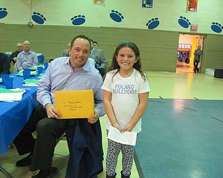 Neighbors | Alexis Bartolomucci.Second-grader Kate Liddle gave Todd Bury of the Poland Rotary an envelope full of thank you letters the students wrote for the Poland Rotary.