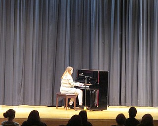 Neighbors | Alexis Bartolomucci.A Poland Seminary High School student played piano as she sang a song during the talent show on Feb. 6.