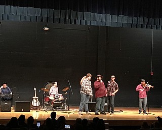 Neighbors | Alexis Bartolomucci.A Poland Seminary High School teacher formed in a band with some students, called "Uncle Father," and performed at the talent show on Feb. 6.