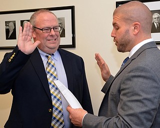 Neighbors | Submitted.MCESC Treasurer Blaise Karlovic is pictured swearing in Jeffery P. Good.