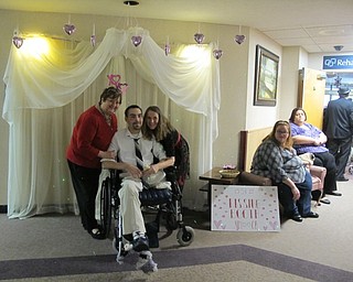 Neighbors | Alexis Bartolomucci.Beeghly Oaks staff members took a picture with a resident in front of the back drop during the Snow Ball Gala on Feb. 12. Pictured are, from left, Concierge Director Carol Zeigler, Anthony Girari and Recreation Director Maureen McCarty.