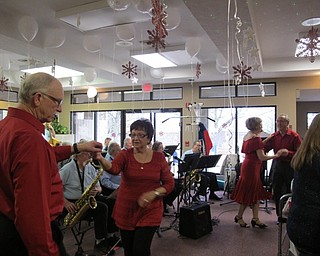 Neighbors | Alexis Bartolomucci.Ballroom dancers danced to the music performed by a community swing band during the Valentine's Gala at Beeghly Oaks on Feb. 12.