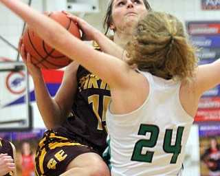 William D. Lewis The Vindicator South East's Riley Norquest(15) tries to shoot past West Branch's Sarrah Tennefoss(24) during 3-2-17 action at Fitch.