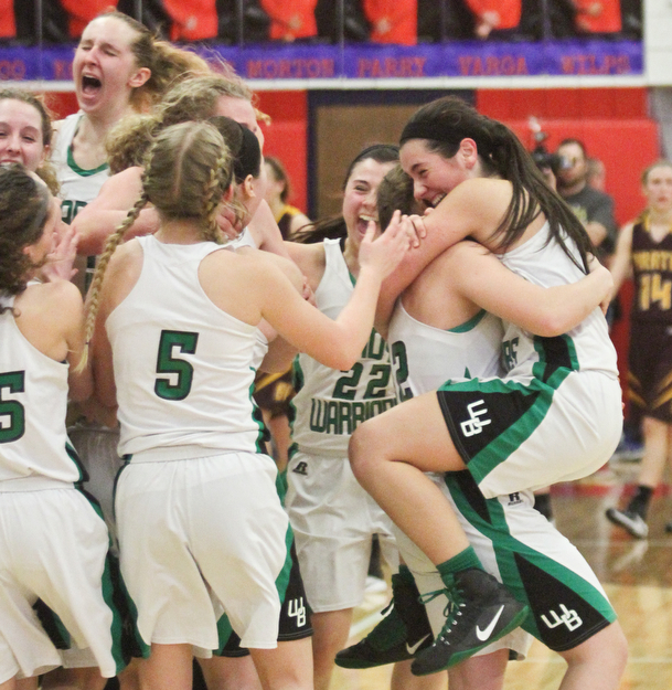 William D Leiws the Vindicator West Branch Players celebrate after defeating South East 3-2-17 at Fitch. At right Kirsten Plocher(12) picks up  Brenna rito (3)