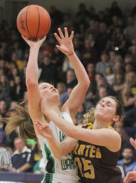 William D. Lewis The Vindicator  Westbranch'sHannah ridgway(14) shoots past South East's RileyNorquest(15)  during 3-2-17 action at Fitch.