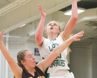 William D. Lewis The Vindicator  Westbranch's Kyla Hovorka(23) shoots over  South East's DAndrea Radcliff(32) during 3-2-17 action at Fitch.