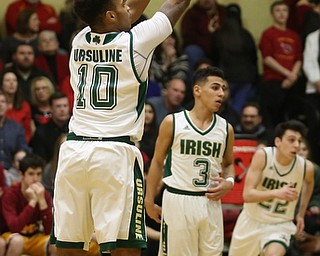 Dwaylin Washington(10) of Ursuline shoots for three during the 1st quarter as Cardinal Mooney takes on Ursuline, Friday, March 3, 2017 at Ursuline High School. Ursuline won 39-37...(Nikos Frazier | The Vindicator)..