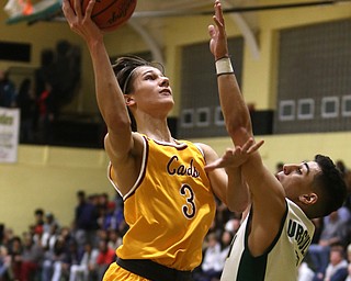 Alec Wollet(3) of Cardinal Mooney goes up for a layup during the 2nd quarter as Cardinal Mooney takes on Ursuline, Friday, March 3, 2017 at Ursuline High School. Ursuline won 39-37...(Nikos Frazier | The Vindicator)..