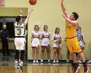 Anise Algahmere(3) of Ursuline goes up for three during the 2nd quarter as Cardinal Mooney takes on Ursuline, Friday, March 3, 2017 at Ursuline High School. Ursuline won 39-37...(Nikos Frazier | The Vindicator)..