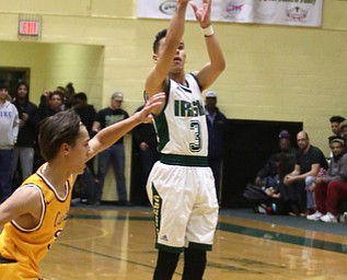 Anise Algahmere(3) of Ursuline goes up for three during the 3rd quarter as Cardinal Mooney takes on Ursuline, Friday, March 3, 2017 at Ursuline High School. Ursuline won 39-37...(Nikos Frazier | The Vindicator)..