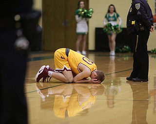 Pat Pelini(10) of Cardinal Mooney falls to the court after missing the last basket in the final seconds of the 4th quarter as Cardinal Mooney takes on Ursuline, Friday, March 3, 2017 at Ursuline High School. Ursuline won 39-37...(Nikos Frazier | The Vindicator)..