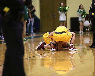 Pat Pelini(10) of Cardinal Mooney falls to the court after missing the last basket in the final seconds of the 4th quarter as Cardinal Mooney takes on Ursuline, Friday, March 3, 2017 at Ursuline High School. Ursuline won 39-37...(Nikos Frazier | The Vindicator)..