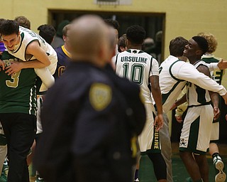 The Ursuline team celebrates their 39-37 victory over Cardinal Mooney, Friday, March 3, 2017 at Ursuline High School. ..(Nikos Frazier | The Vindicator)..
