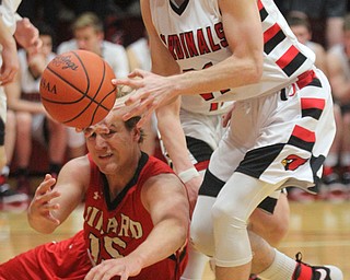 William D. Lewis the Vindicator Girard's Mark Waid(15) and Canfield's Zach Tinkey(21) go for a loose ball during 3-3-17 action at Canfield.