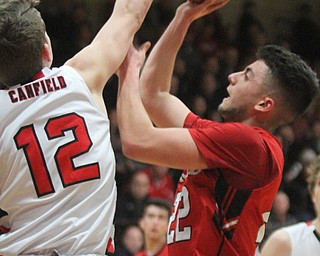 William D Lewis The Vindicator  Girard'sAnthony Graziano(22) is block by Canfield's Ethan Kalina(12) during 3-3-17 action at Canfield.