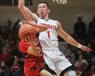 William D. Lewis The Vindicator  Canfield's Jake Cummings(1) blocks Girard's Austinclausell(2) during 3-3-17 action at Canfield.
