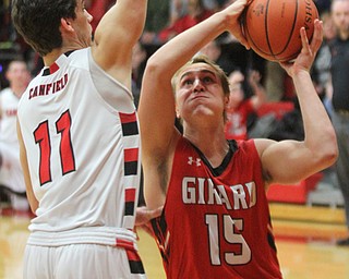 William D Lewis the Vindicator  Girard's Mark Waid (15) shoots past Canfield's Spencer Woolley(11) during 3-3-17 action at Canfield.