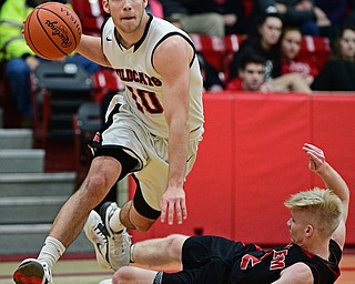 STRUTHERS, OHIO - MARCH 3, 2017: AJ Mussolino #10 of Struthers drives to the basket after knocking down Garrett Dickey #2 of Salem, drawing the charge, during the first half of their game Friday night at Struthers High School. DAVID DERMER | THE VINDICATOR