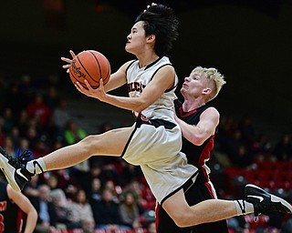 STRUTHERS, OHIO - MARCH 3, 2017: Ethan Vo #11 of Struthers goes to the basket while being pressured by Garrett Dickey #2 of Salem during the first half of their game Friday night at Struthers High School. DAVID DERMER | THE VINDICATOR