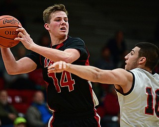 STRUTHERS, OHIO - MARCH 3, 2017: Mitch Davidson #14 of Salem looks to pass while being pressured by AJ Mussolino #10 of Struthers during the second half of their game Friday night at Struthers High School. DAVID DERMER | THE VINDICATOR