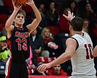 STRUTHERS, OHIO - MARCH 3, 2017: Zach Bezon #13 of Salem puts up a three point shot over AJ Mussolino #10 of Struthers during the second half of their game Friday night at Struthers High School. DAVID DERMER | THE VINDICATOR
