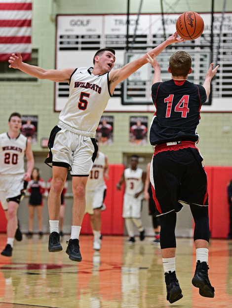 STRUTHERS, OHIO - MARCH 3, 2017: Andrew Carbon #5 of Struthers tips the pass intended for Mitch Davidson #14 of Salem out of bounds during the second half of their game Friday night at Struthers High School. DAVID DERMER | THE VINDICATOR
