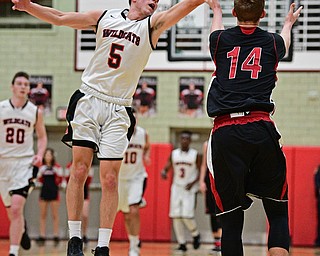 STRUTHERS, OHIO - MARCH 3, 2017: Andrew Carbon #5 of Struthers tips the pass intended for Mitch Davidson #14 of Salem out of bounds during the second half of their game Friday night at Struthers High School. DAVID DERMER | THE VINDICATOR