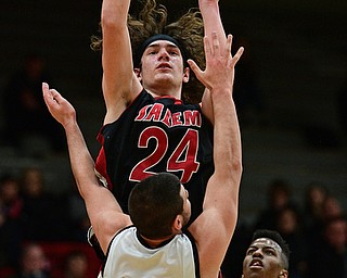 STRUTHERS, OHIO - MARCH 3, 2017: Chase Ackerman #24 of Salem puts up a shot over AJ Mussolino #10 of Struthers during the second half of their game Friday night at Struthers High School. DAVID DERMER | THE VINDICATOR