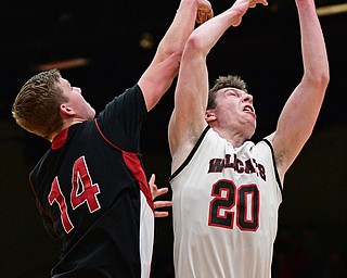 STRUTHERS, OHIO - MARCH 3, 2017: Ryan Leonard #20 of Struthers has his shot blocked by Mitch Davidson #14 of Salem during the second half of their game Friday night at Struthers High School. DAVID DERMER | THE VINDICATOR