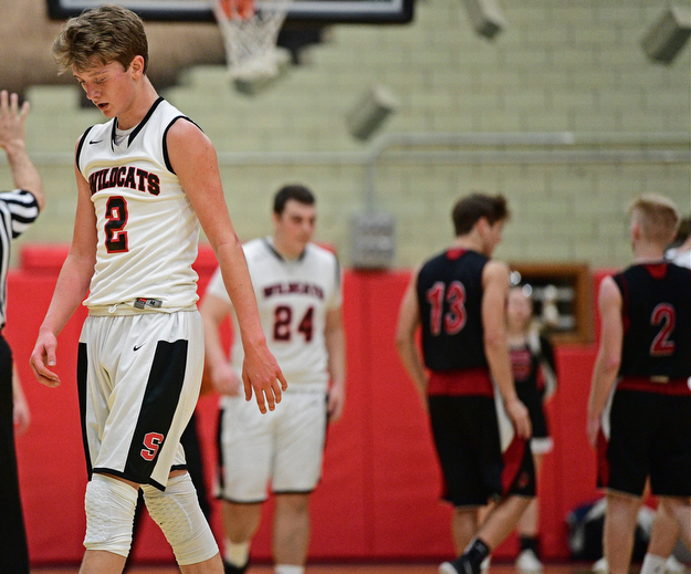 STRUTHERS, OHIO - MARCH 3, 2017: Carson Ryan #2 of Struthers walks to the bench after fouling out of the game late in the fourth quarter of their game Friday night at Struthers High School. DAVID DERMER | THE VINDICATOR
